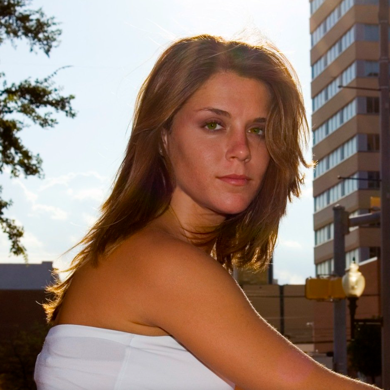 beautiful young woman posing outside