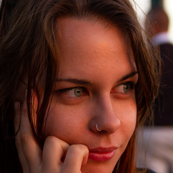 close up photo to beautiful young woman with green eyes